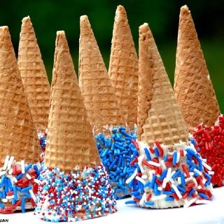 4th of July cones. Dip in white chocolate and roll in sprinkles!